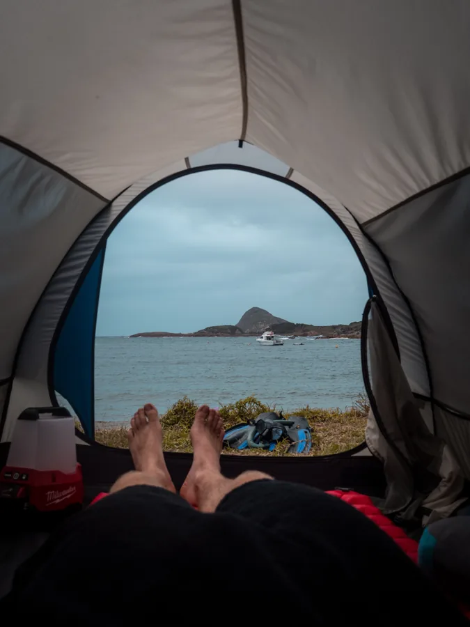 The view out over the water from a tent doorway at camp